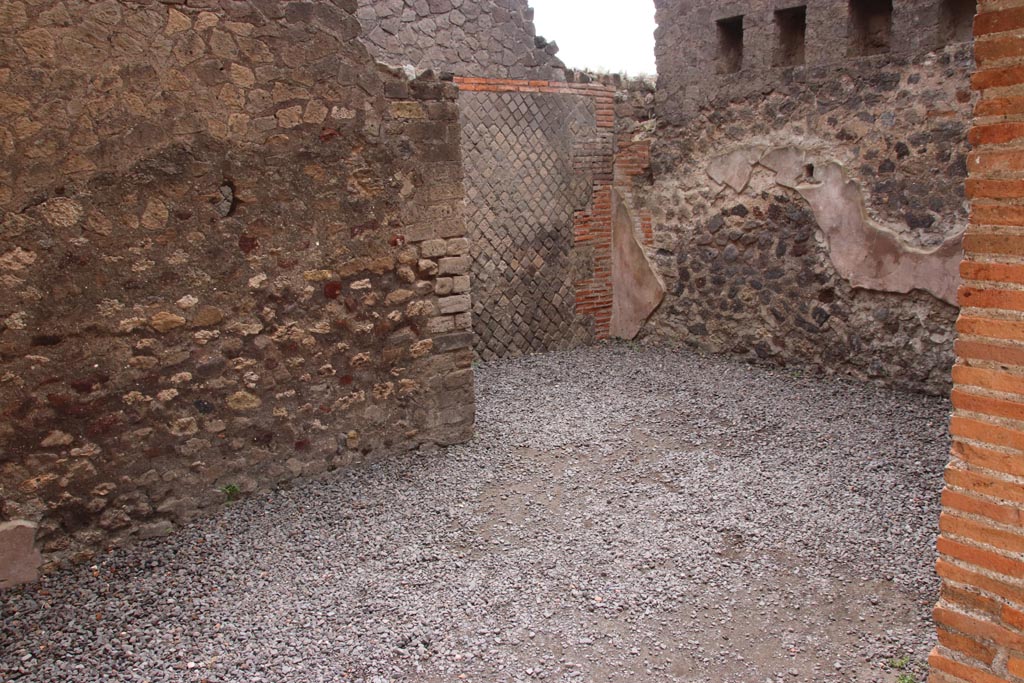 VIII.2.16 Pompeii. May 2024.
Looking towards south-east corner of room, and opening leading in direction of entrance corridor, which would have been under the stairs to the upper floor. Photo courtesy of Klaus Heese.