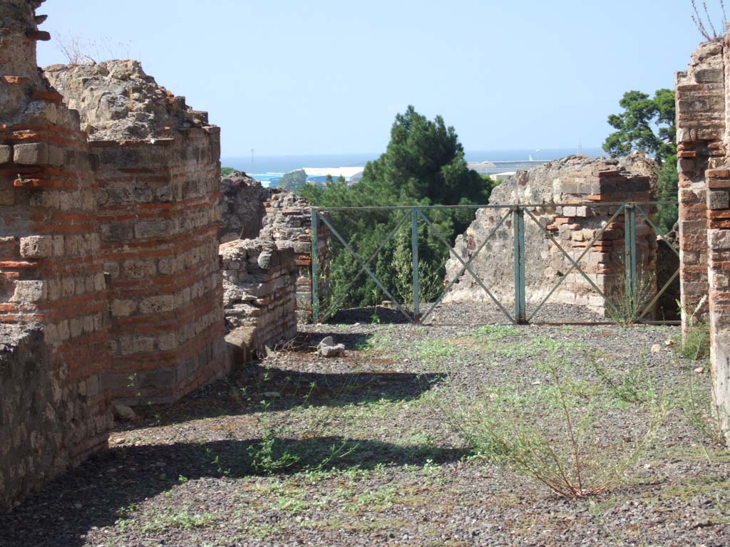 VIII.2.20 Pompeii. September 2005. Area at end of corridor.
According to Jashemski, this block of dwellings was built on five levels, and had three porticoed terraces on the rear.
The upper (4th) terrace was not preserved.
See Jashemski, W. F., 1993. The Gardens of Pompeii, Volume II: Appendices. New York: Caratzas. (p.207)