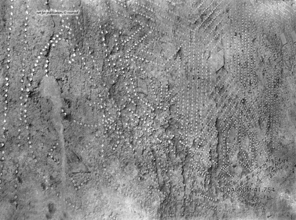 VIII.2.26 Pompeii. c.1930. Room 3, exedra, flooring of cocciopesto mixed with lava and showing a beautiful well-executed design.
The centre of which was an enormous eight-pointed star or rosette, formed by diamond shapes.
DAIR 41.754. Photo © Deutsches Archäologisches Institut, Abteilung Rom, Arkiv.
See Pernice, E. 1938. Pavimente und Figürliche Mosaiken: Die Hellenistische Kunst in Pompeji, Band VI. Berlin: de Gruyter, (tav. 45.4, above.)