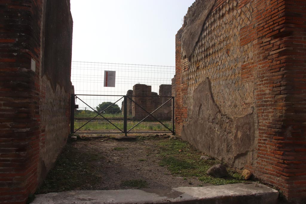 VIII.2.30 Pompeii. October 2023.
Looking south through entrance doorway, and west side of front wall and vestibule. Photo courtesy of Klaus Heese.