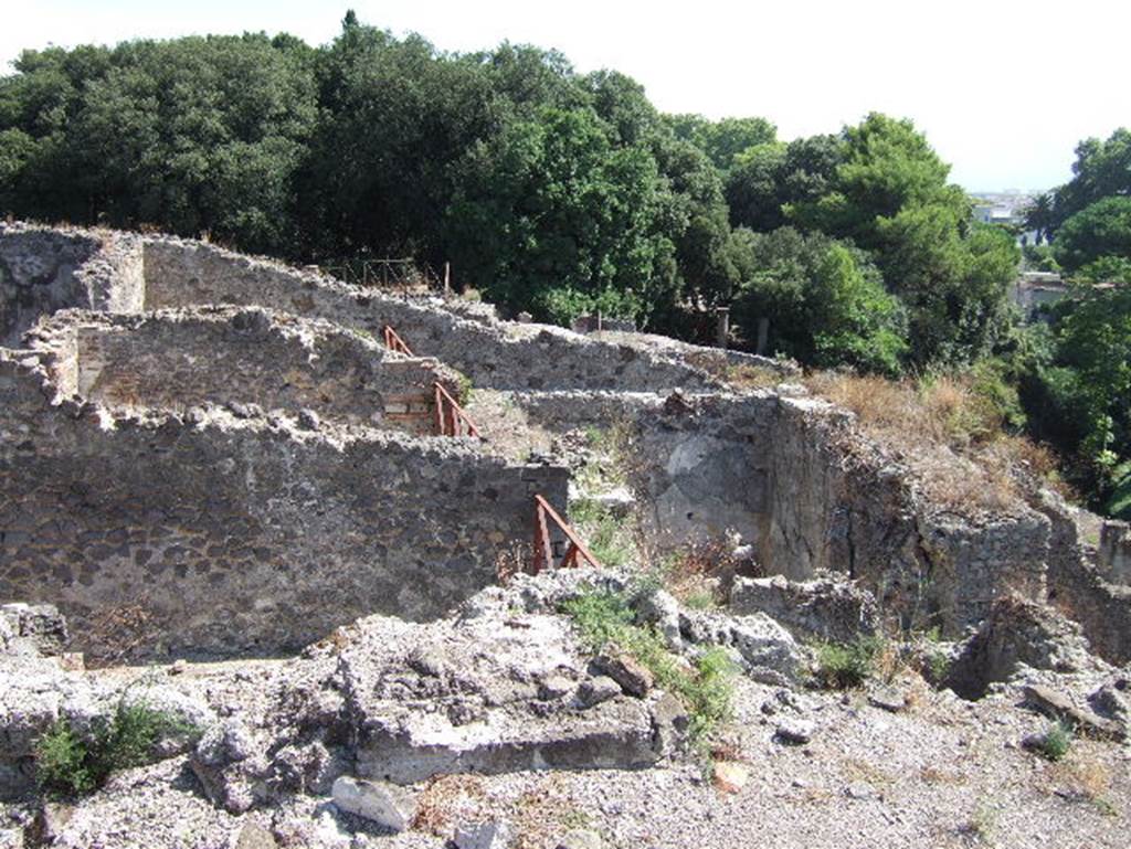 VIII.2.34 Pompeii. May 2006. Looking east across rooms from VIII.2.30. On the left are rooms ‘o’, (nearest) ‘m’ and ‘n’ on the street level, visible in the centre right is room ‘4’ on the lower rear level.
