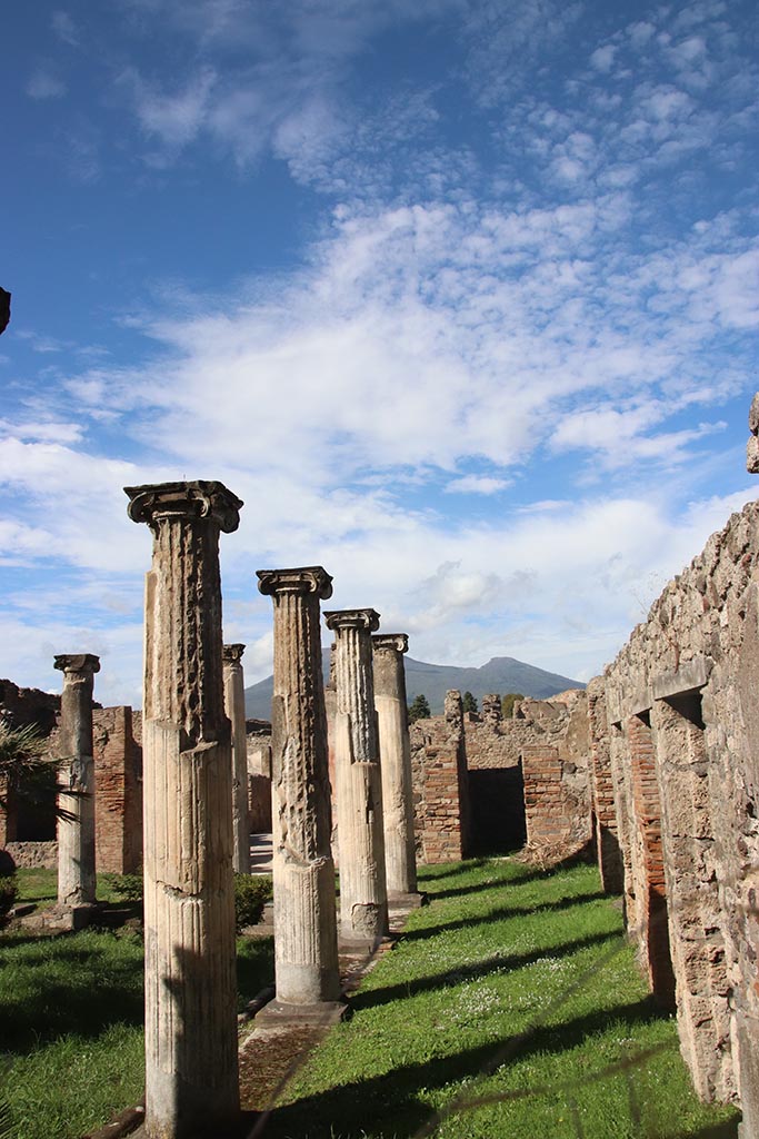 VIII.3.8 Pompeii. October 2024. 
Looking north along east portico, towards doorway to room 21, in north-east corner.
Photo courtesy of Klaus Heese.
