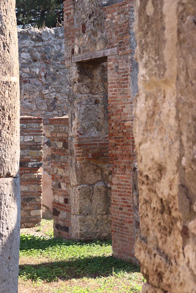 VIII.3.27 Pompeii. October 2022.
Looking south-east from entrance corridor towards corridor on south side of peristyle, leading to kitchen, etc.
Photo courtesy of Klaus Heese.