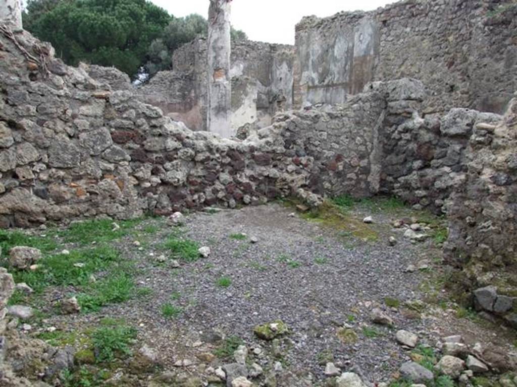 VIII.3.27 Pompeii. December 2007. Looking towards south-east corner of kitchen rooms, with VIII.3.24 in background.
The remains of a room, on the left centre, would have belonged to the east wall of the kitchen rooms.
The south wall of a small room in the kitchen area can be seen, centre right.
The broken wall, on the right, would appear to lead into a long room on the south side of the kitchen rooms, and seems to be part of VIII.3.24.