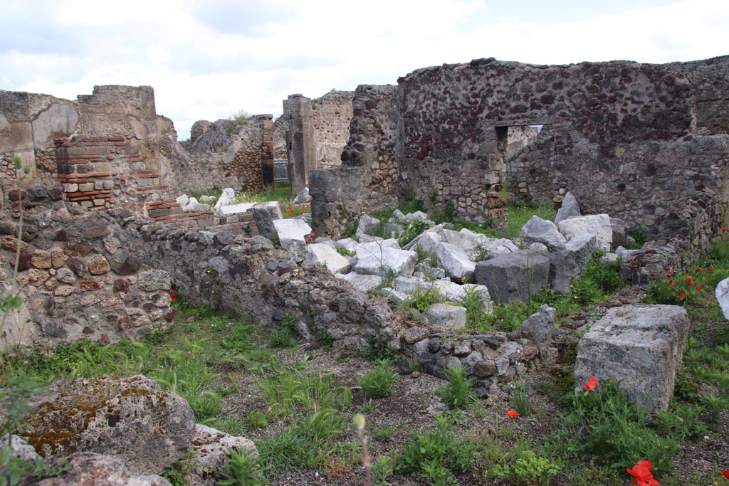 VIII.3.31 Pompeii. May 2024. 
Looking east across small room or cupboard in the north-west corner of the peristyle, towards the oecus with two doorways.
Photo taken across the wall of VIII.3.29. Photo courtesy of Klaus Heese. 
