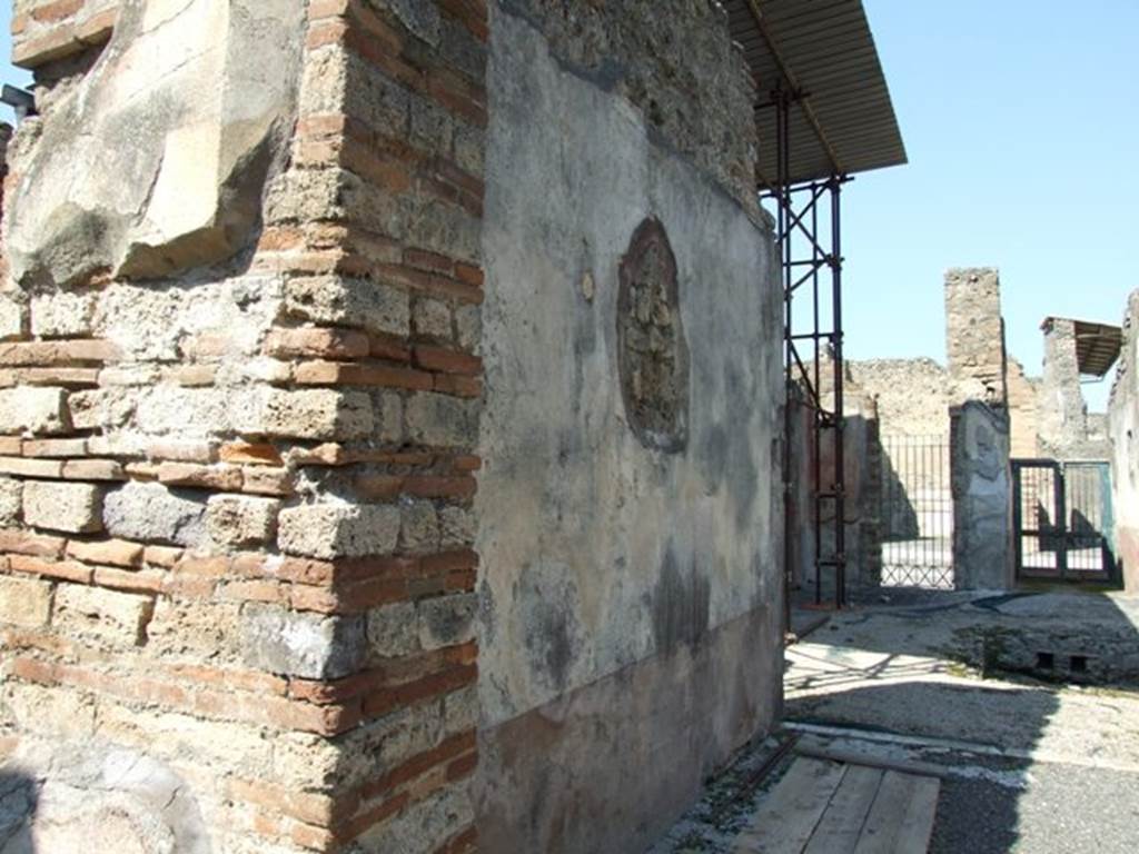 VIII.4.4 Pompeii. March 2009. Room 20, west wall of tablinum. Looking north.
According to Breton, on the west wall facing Leda, the painting was more or less destroyed when excavated.
One could only see a fragment of a sitting person, perhaps Adonis with a dog at his feet.
See Breton, Ernest. 1870. Pompeia, Guide de visite a Pompei, 3rd ed. Paris, Guerin. 
See Helbig, W., 1868. Wandgem�lde der vom Vesuv versch�tteten St�dte Campaniens. Leipzig: Breitkopf und H�rtel. (961 Endymion?)

According to PPM, at the south end of the west wall in the yellow side panel was another vignette of the Seasons showing Summer (H 984).
Described by Minervini (BAI 1861, p.49) as �a naked female figure seen from the rear with cloth draped around her body and legs: in her right hand she held a branch/ear of corn, and a scythe in her left hand�.

