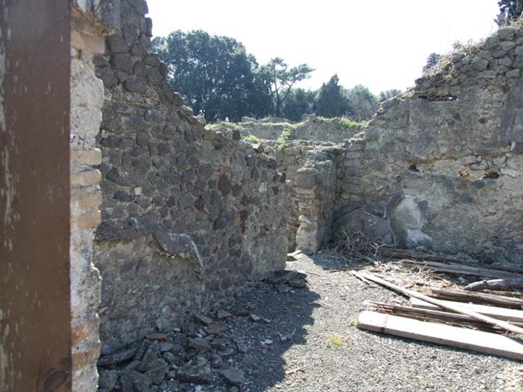 VIII.4.15 Pompeii.  March 2009. Room 17, exedra. South wall, with door linking to VIII.4.30.