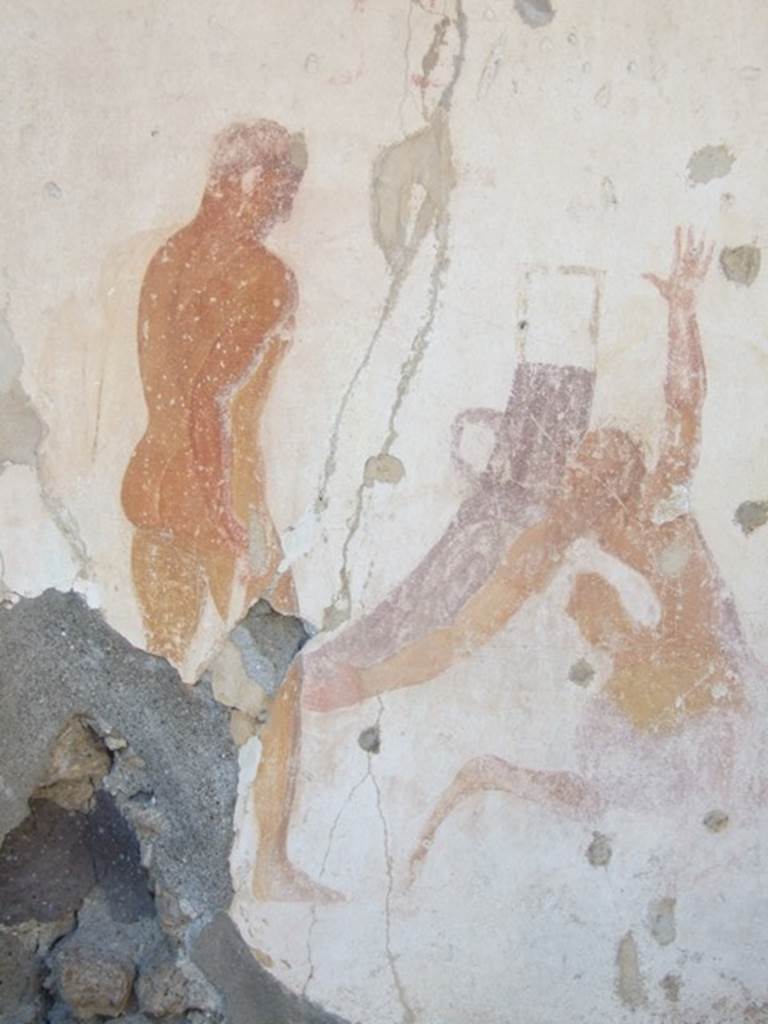 VIII.5.15 Pompeii. March 2009. Room 2, detail of wall painting on west wall. According to NdS, on the west wall of this area was a representation (width 1.08, height 1.65) of the well-known subject of Hercules and Nessus. On the left stood the hero, naked with his back to the viewer, carrying his lion-skin on his left shoulder, armed with a quiver and holding the club in his right hand. He was watching the centaur, prostrate before him, reaching out with his arms or taking the baby from the arms of Dejanira, who was seen veiled in the chariot in the background. Two white horses were attached to the chariot. The conservation of it was not good, mainly in the figures of Dejanira and the child, which were faded.
See NdS, 1882, (p.397)
