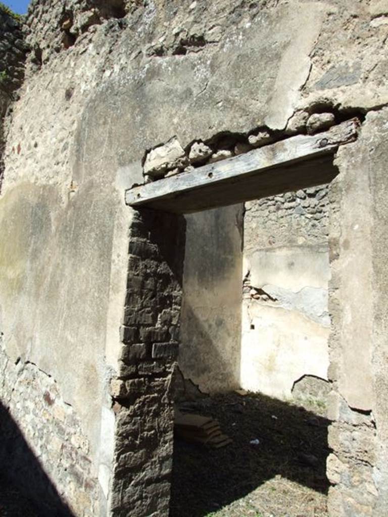 VIII.5.37 Pompeii.  March 2009.  Room 11. North wall and Doorway to Room 12.