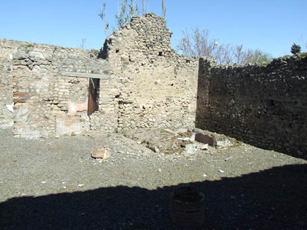 VIII.5.39 Pompeii. March 2009. Room 1, looking north-east from entrance.
According to Jashemski –
“The street entrance led directly into a two-storied portico supported by two columns.
The portico was separated from the small garden on the right by a low wall, which had an entrance into the garden.
There was a gutter along the west edge of the garden.
In the north part of the garden was a masonry triclinium (l. medius, 2.63m; l. imus, 3.45m; l. summus 3.10m) and a table (0.59m diameter), faced with marble of various colours, which had a hole in the centre for a fountain jet.
The garden was decorated with many small garden sculptures –
Five small heads of Bacchic herms (0.16m high), Naples Muz. Nat. inv. nos. 120 036 – 120 040.
A tragic mask (oscillum) (0.16m high), Naples Muz. Nat. inv. no. 120 041.
A toad fountain, lacking head (0.14m long), Naples Muz. Nat. inv. no. 120 042.
A tortoise for a fountain, lacking head (0.12m long), Naples Muz. Nat. inv. no. 120 043.
Two small brackets, Naples Muz. Nat. inv. no. 120 044, 120 045.
Two fluted monopodia with the Greek inscription “of Serapion”.
Jashemski sources –
Sogliano, NSc, (1882), p.280, 324, 359-360;
Mau, BdI, (1884) p. 127-129;
Mau-Kelsey, p.341-3, plan on p.341;
Boyce, p. 78, no.372;
Soprano, p. 301, no. 16,
Dohn, p.46-47’
Dwyer, ”Oscilla”, p. 281, no. 106.
See Jashemski, W. F., 1993. The Gardens of Pompeii, Volume II: Appendices. New York: Caratzas. (p.218).