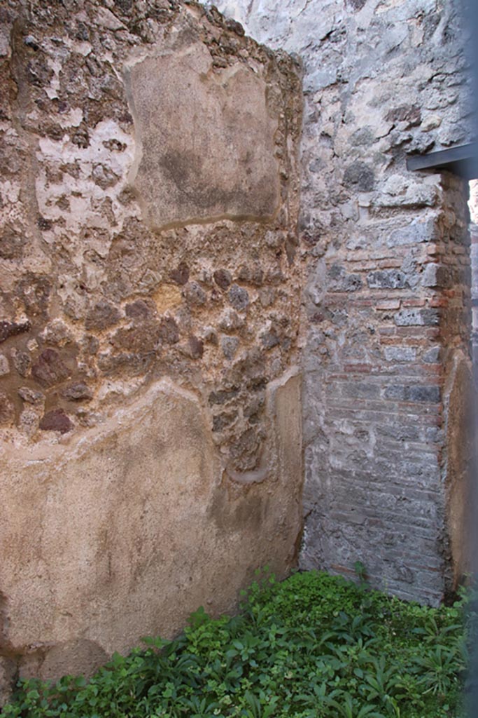VIII.6.8 Pompeii. October 2022. 
Looking south-west along wall on west side of doorway to small room opposite entrance doorway.
On the right is a doorway leading into VIII.6.9. Photo courtesy of Klaus Heese. 
