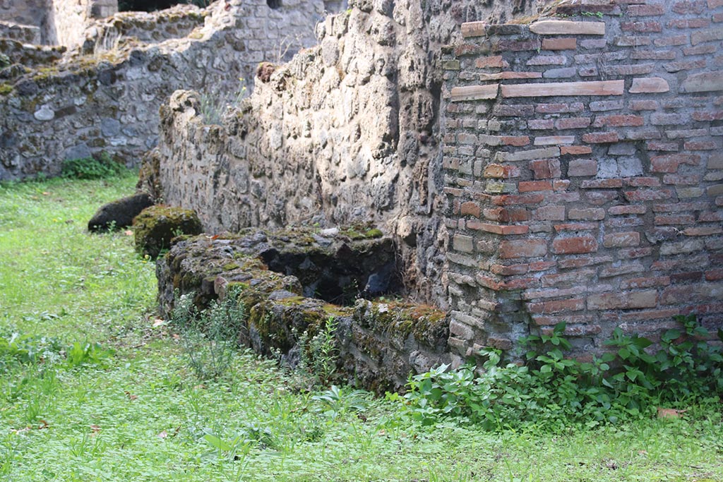 VIII.7.1 Pompeii. October 2024. 
Looking north-west to detail of north wall, three rectilinear basins or watering troughs for horses? Photo courtesy of Klaus Heese.
