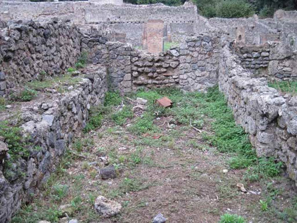 VIII.7.1 Pompeii. September 2010. Second room east of corridor, Fiorelli thought possibly a dormitory. Looking east towards Via Stabiana, (blocked doorway to VIII.7.4).  Photo courtesy of Drew Baker. During excavations in 2006 a drain was found in the centre of the room running from west to east (front to back in this photo). The drain continued to the street where a rectangular exit point is still visible in the front of the kerb. See http://www.fastionline.org/docs/FOLDER-it-2006-71.pdf