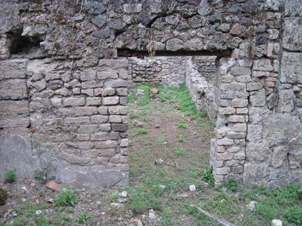 VIII.7.1 Pompeii. September 2010.  Looking east through doorway from garden area, into dormitory room. Photo courtesy of Drew Baker.
