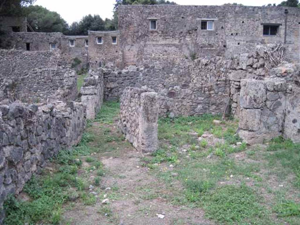 VIII.7.10 Pompeii. September 2010. Looking west across shop towards rear.