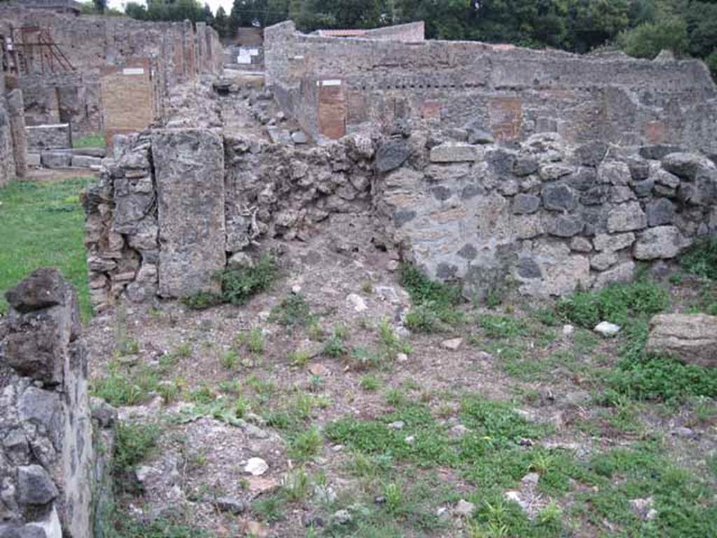 VIII.7.11 Pompeii. September 2010. Triclinium on south side of corridor, looking east towards doorway to corridor in north-east corner. Photo courtesy of Drew Baker.
