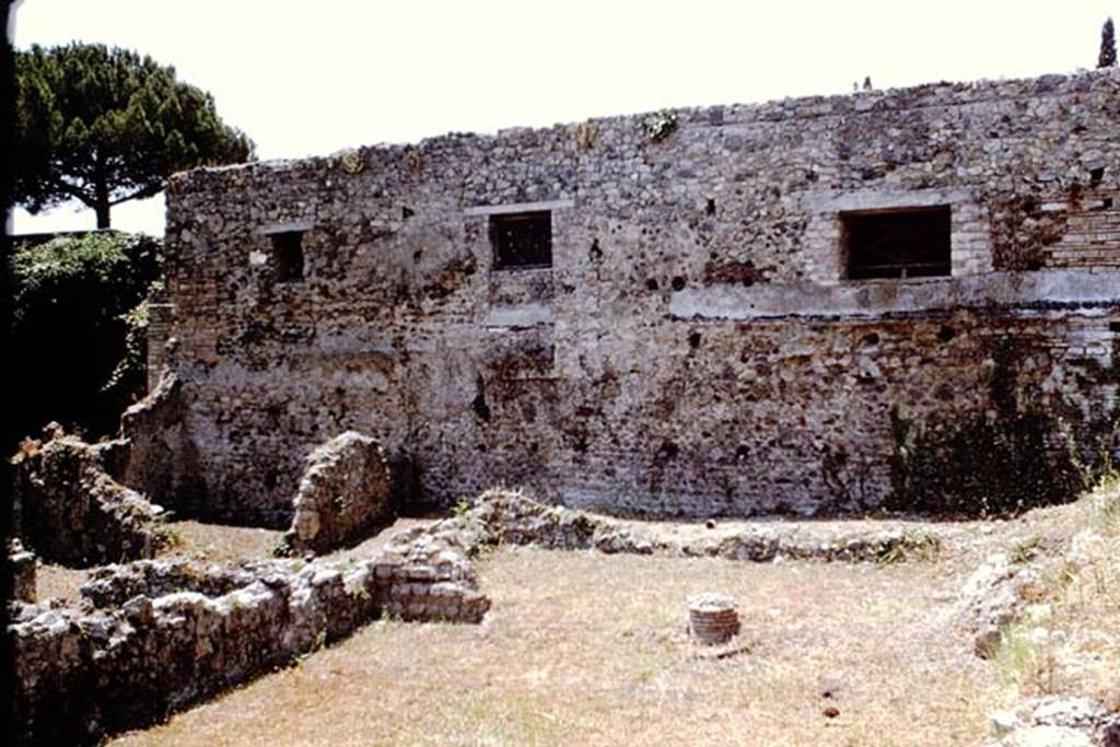 VIII.7.12 Pompeii. 1966. 
Garden area at rear, looking west towards base of column in wide entrance of room at rear. Photo by Stanley A. Jashemski.
Source: The Wilhelmina and Stanley A. Jashemski archive in the University of Maryland Library, Special Collections (See collection page) and made available under the Creative Commons Attribution-Non Commercial License v.4. See Licence and use details.
J66f0203

According to PARP:PS – there was a hearth/cooking facilities (no.6 on their plan) against the north wall in the rear area.
The remains of this can be seen on the right of the above photo.

