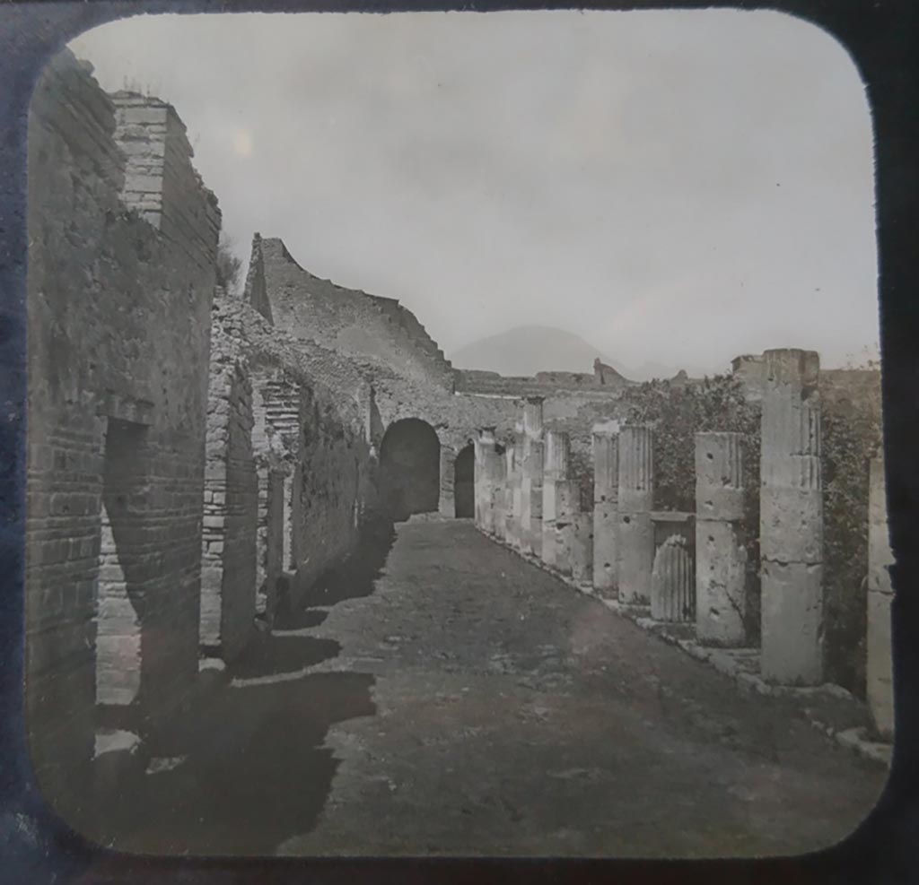 VIII.7.16 Pompeii. c.1900. C. and G. Lantern slide published by A. Laverne. Looking north along west portico of peristyle.