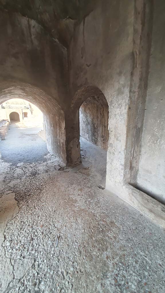 VIII.7.20 Pompeii. August 2021. Looking west to entrances to the Large Theatre.
On the left to the area in front of the stage known as the orchestra. 
On the right the arched entrance to the ramp leading to media cavea. 
Foto Annette Haug, ERC Grant 681269 DÉCOR.



