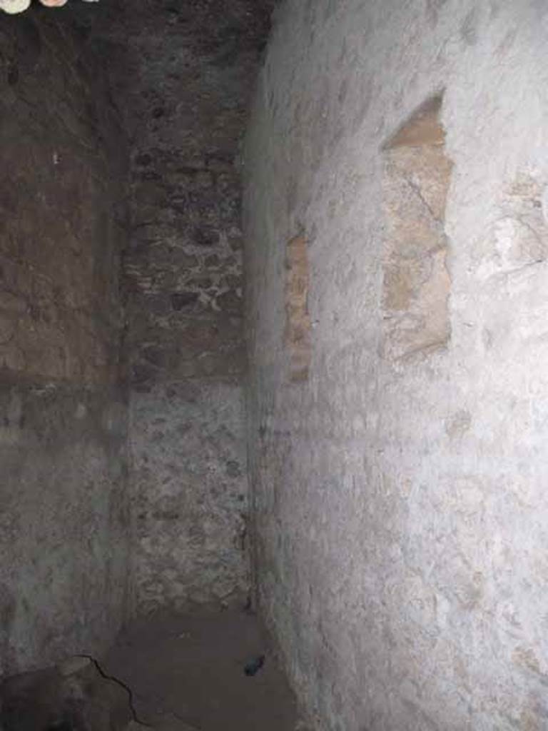 VIII.7.21 Pompeii. September 2010.  Looking into the latrine from entrance.  
Orientation looking south towards quadriporticus, theatre to the left, triangular forum to the right.  Photo courtesy of Drew Baker.
