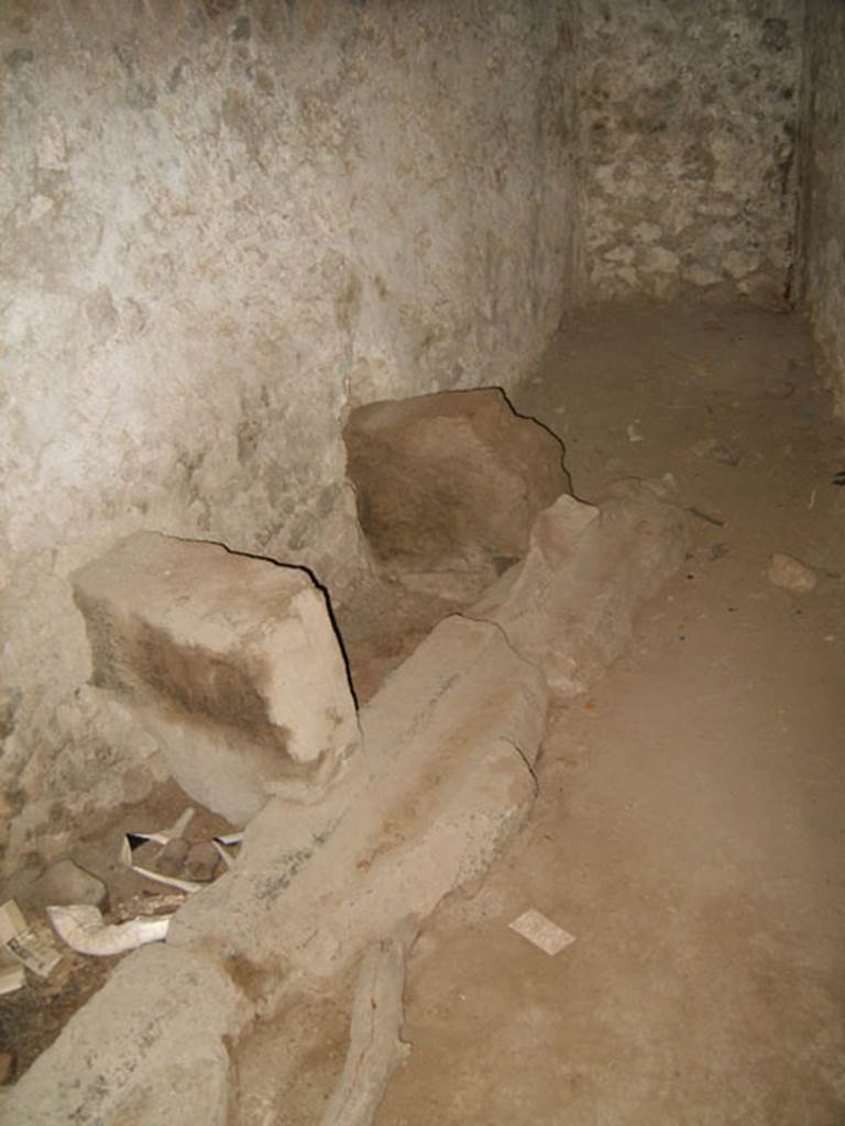 VIII.7.21 Pompeii. July 2007. Latrine by the entrance to the Large Theatre from the Triangular Forum. According to Barry Hobson, the place itself is dark with two small windows, and despite the fact that there would have been water running through the drain to remove excreta, it must have been very unpleasant in Roman times. See Hobson, B., 2009. Latrinae et foricae: Toilets in the Roman World. London; Duckworth. p. 108. Photo courtesy of Drew Baker.