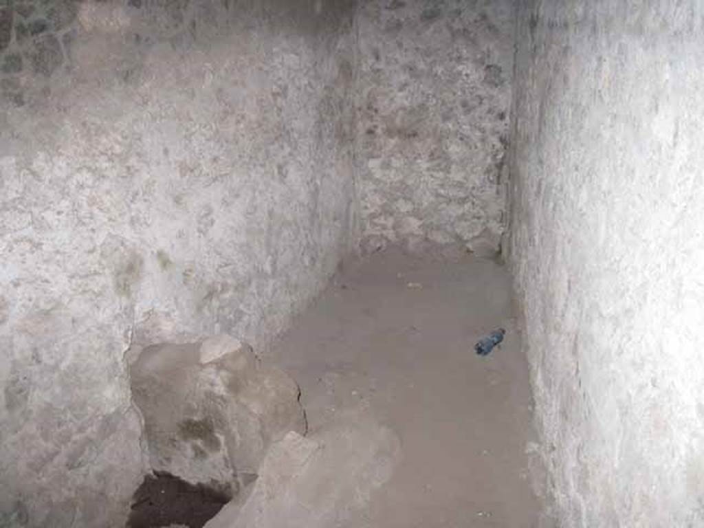 VIII.7.21 Pompeii. September 2010. End wall of latrine. Orientation looking south towards quadriporticus, theatre to the left, triangular forum to the right. Photo courtesy of Drew Baker.
