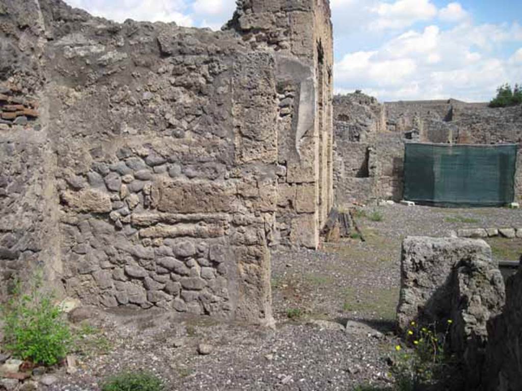 VIII.7.24 Pompeii. September 2010. East wall of oecus, with doorway to atrium. Photo courtesy of Drew Baker.
