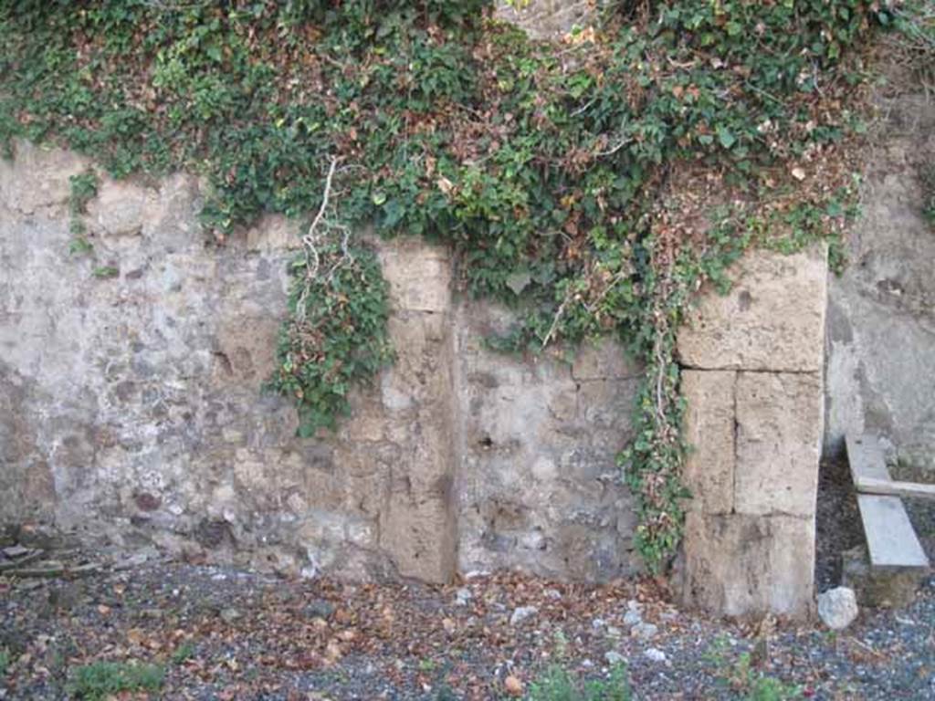 VIII.7.24 Pompeii. September 2010. West wall of ala on south side of atrium, with blocked doorway originally linking to triclinium of VIII.7.26.
Photo courtesy of Drew Baker.
