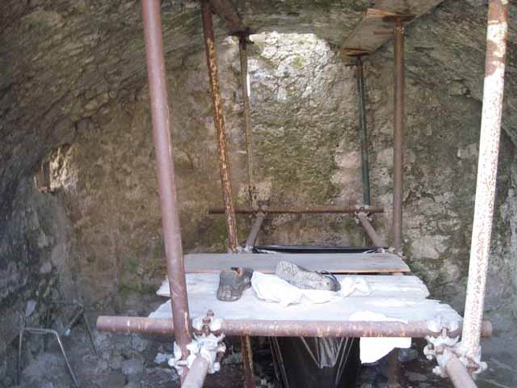 VIII.7.24 Pompeii. September 2010. Looking south into storage room on south side of atrium. In the south-east corner can be seen the blocked doorway from the small room or latrine in VIII.7.23. Photo courtesy of Drew Baker.


