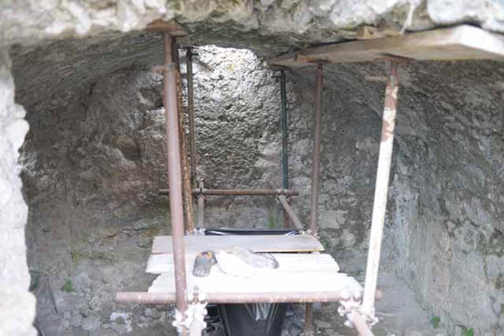 VIII.7.24 Pompeii. October 2010. Looking south from doorway of storage room. The images showing the vaulted room, the 5 photos below, were taken from the right hand side of the room, approximately from where the green scaffold pole is. Photo and information courtesy of Drew Baker/Gareth Beale/Hembo Pagi.
