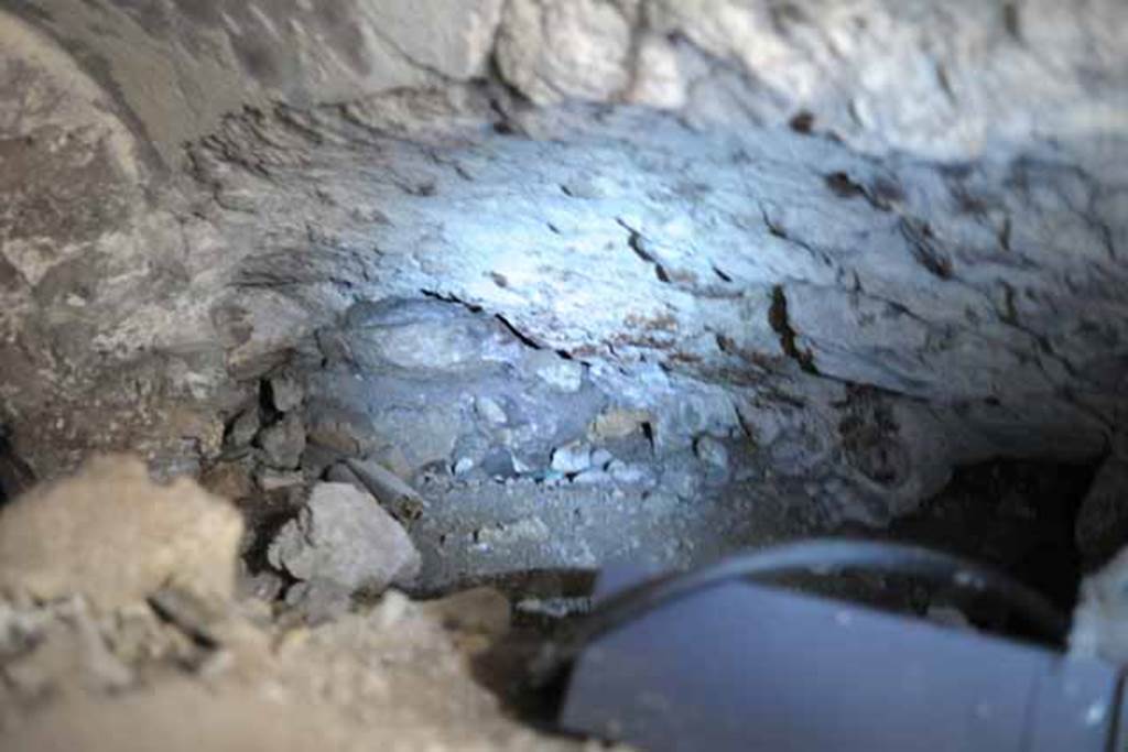 VIII.7.24 Pompeii. October 2010. North-west side of vaulted room, half filled with debris, leading west off of "storage room". There does seem to have a recess in the north wall.  Photo and information courtesy of Drew Baker/Gareth Beale/Hembo Pagi.
