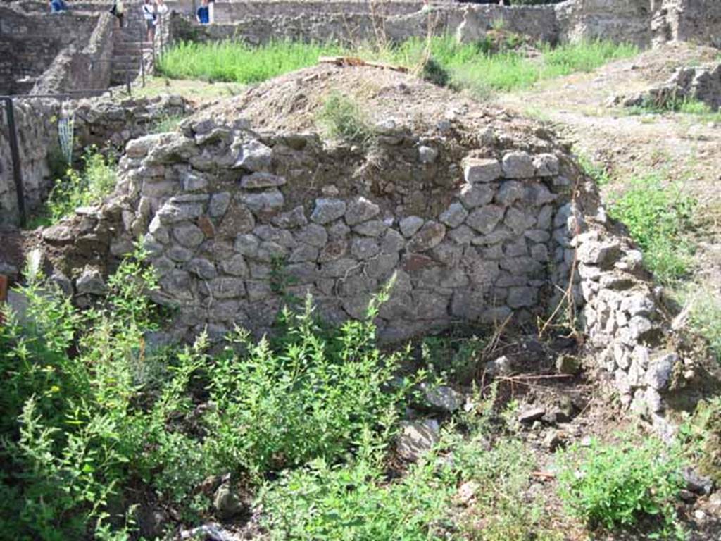 VIII.7.24 Pompeii. September 2010. West wall of room on south side of garden area. Looking west towards theatre. To the rear of this wall, on the left, can be seen another room, the one in the south-west corner. Photo courtesy of Drew Baker.
