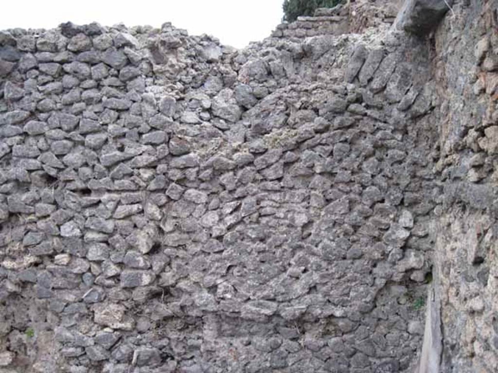 VIII.7.23 Pompeii. October 2010. In VIII.7.23 looking west towards Temple of Isis. (HP notes an arch in the wall - this would correspond well to the arch of the room D). Photo and information courtesy of Drew Baker/Gareth Beale/Hembo Pagi.
