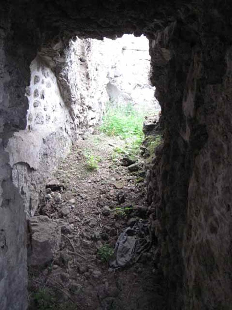 VIII.7.22/23/24 Pompeii. October 2010. Looking north along corridor A, linking rear of VIII.7.23/22 to the underground rooms. Light is from the "collapsed" area see Upper levels. Photo and information courtesy of Drew Baker/Gareth Beale/Hembo Pagi.

