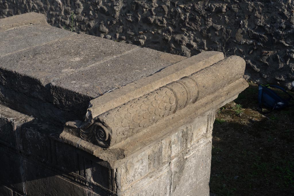 VIII.7.25 Pompeii. October 2023. 
Detail of north-west corner and west side of altar, from top of stairs to podium with cella. Photo courtesy of Johannes Eber.
