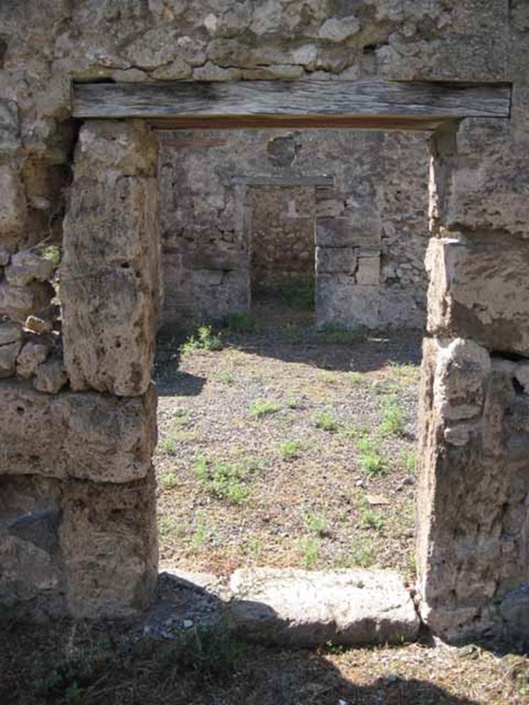 VIII.7.26 Pompeii. September 2010. Looking west through doorway from triclinium on east side of atrium. Photo courtesy of Drew Baker.