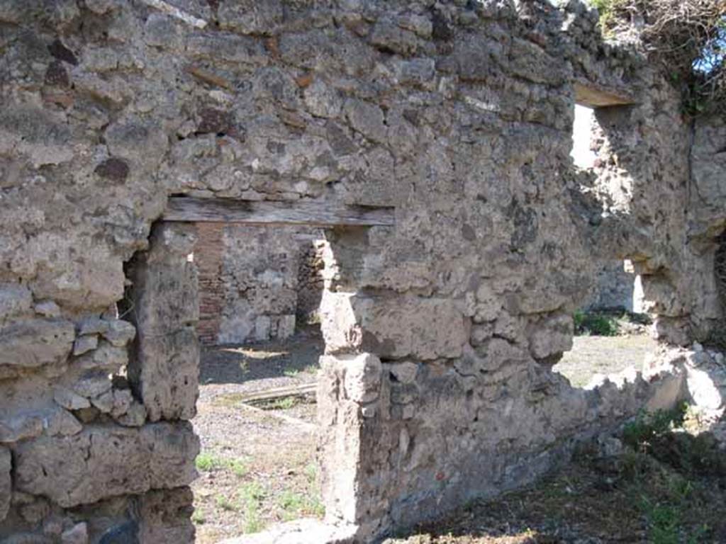 VIII.7.26 Pompeii. September 2010. West wall of triclinium, looking west through doorway and window into atrium. Photo courtesy of Drew Baker.