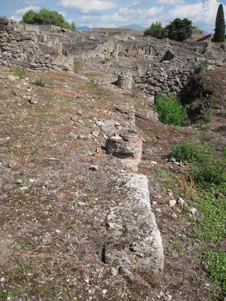 VIII.7.26 Pompeii. September 2010. Looking east along north portico showing edge of garden wall and position of remains of columns. Photo courtesy of Drew Baker.