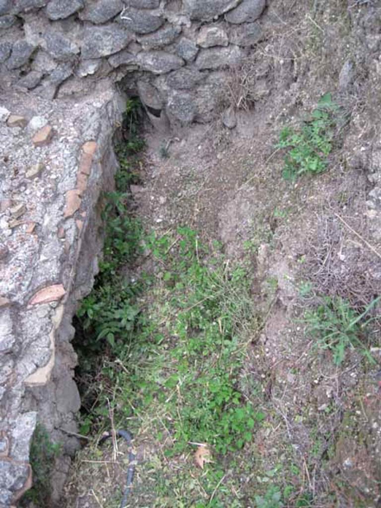 VIII.7.26 Pompeii. October 2010. North-east corner of upper part of VIII.7.26 garden (north portico to left of image). Excavated(?) area top of image shows terracotta pipe in partition wall with VIII.7.24. Looking east.
Photo and information courtesy of Drew Baker/Gareth Beale/Hembo Pagi