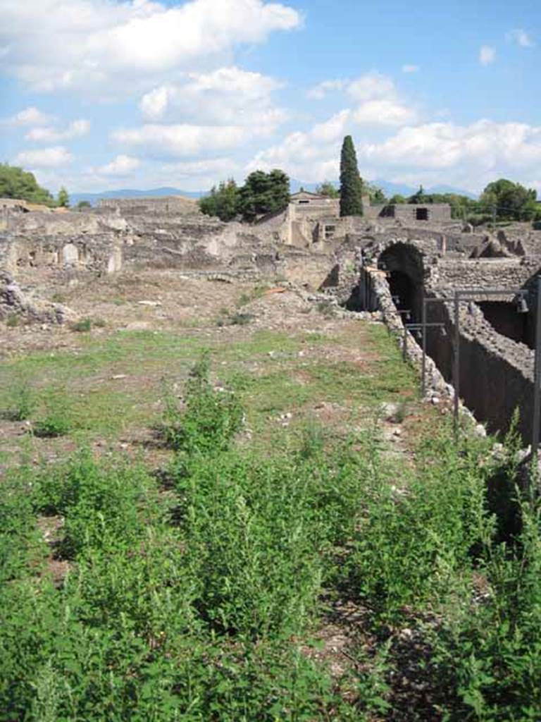 VIII.7.26 Pompeii. September 2010. Remains of east wall of garden looking east towards Via Stabiana, (sloping passage to theatre right of image)
Photo courtesy of Drew Baker.