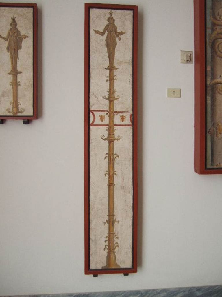 VIII.7.28 Pompeii.  Priestess on a candelabrum carrying a crocodile.  
Found in passageway of arch.  Now in Naples Archaeological Museum.
