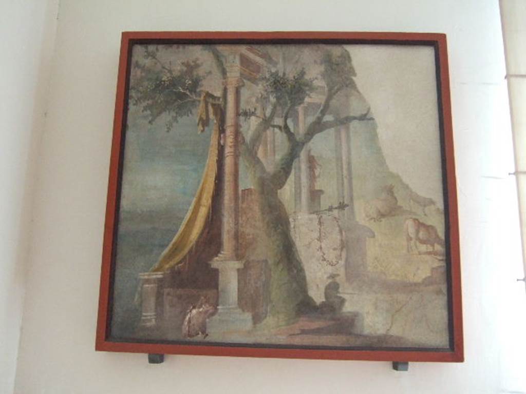 VIII.7.28 Pompeii. Found in the Ekklesiasterion, on the west wall at the north end. 
The painting shows references to the Egyptian cults, with the sacred door, the temple, and the amphora with Garland, which is a reminder of the containers of holy water used during the rites of the cult of Isis. Ten similar amphorae were found at Pompeii with the inscription Serapis dora.
Now in Naples Archaeological Museum. Inventory number 8558.

