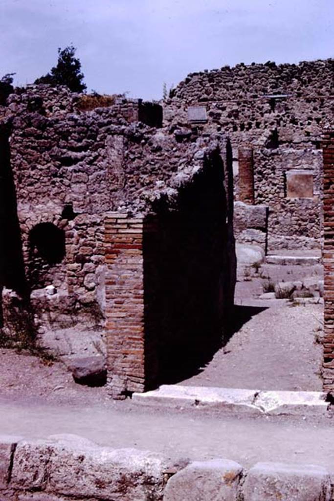 IX.1.12 Pompeii. 1966. Entrance doorway, on right, with IX.1.11, on left. Photo by Stanley A. Jashemski.
Source: The Wilhelmina and Stanley A. Jashemski archive in the University of Maryland Library, Special Collections (See collection page) and made available under the Creative Commons Attribution-Non Commercial License v.4. See Licence and use details.
J66f0117