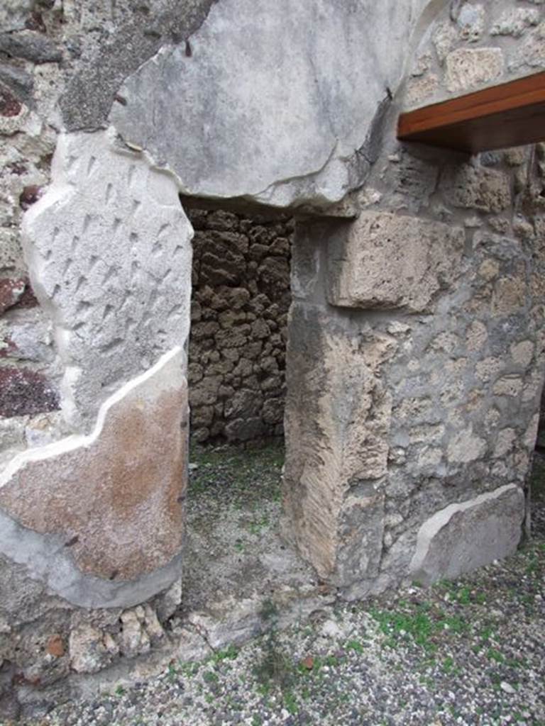 IX.1.12 Pompeii. December 2007. Small doorway in east wall of south east corner of atrium, leading to room with stairs of wood.