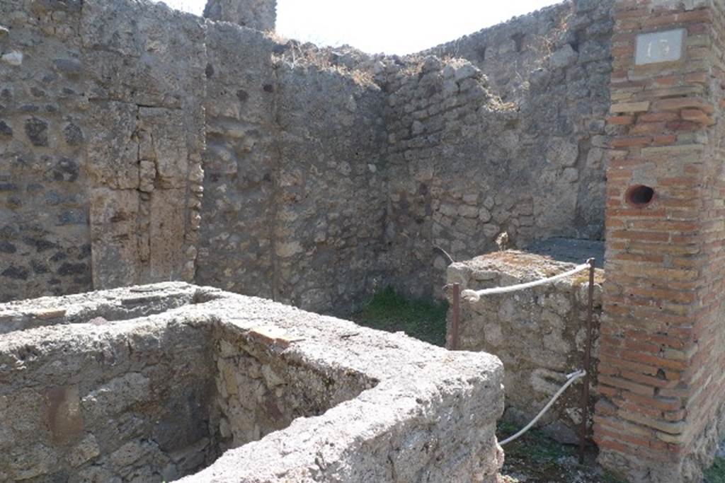 IX.1.13 Pompeii. July 2010. Looking south-east across counter. Photo courtesy of Michael Binns. A few small plaster fragments of Opus signinum were preserved here and there on the walls. See Gallo, A: L’insula I della Regione IX, Settore Occidentale, in Studi della Soprintendenza archeologica di Pompei, no. I, 2001, (p.53)