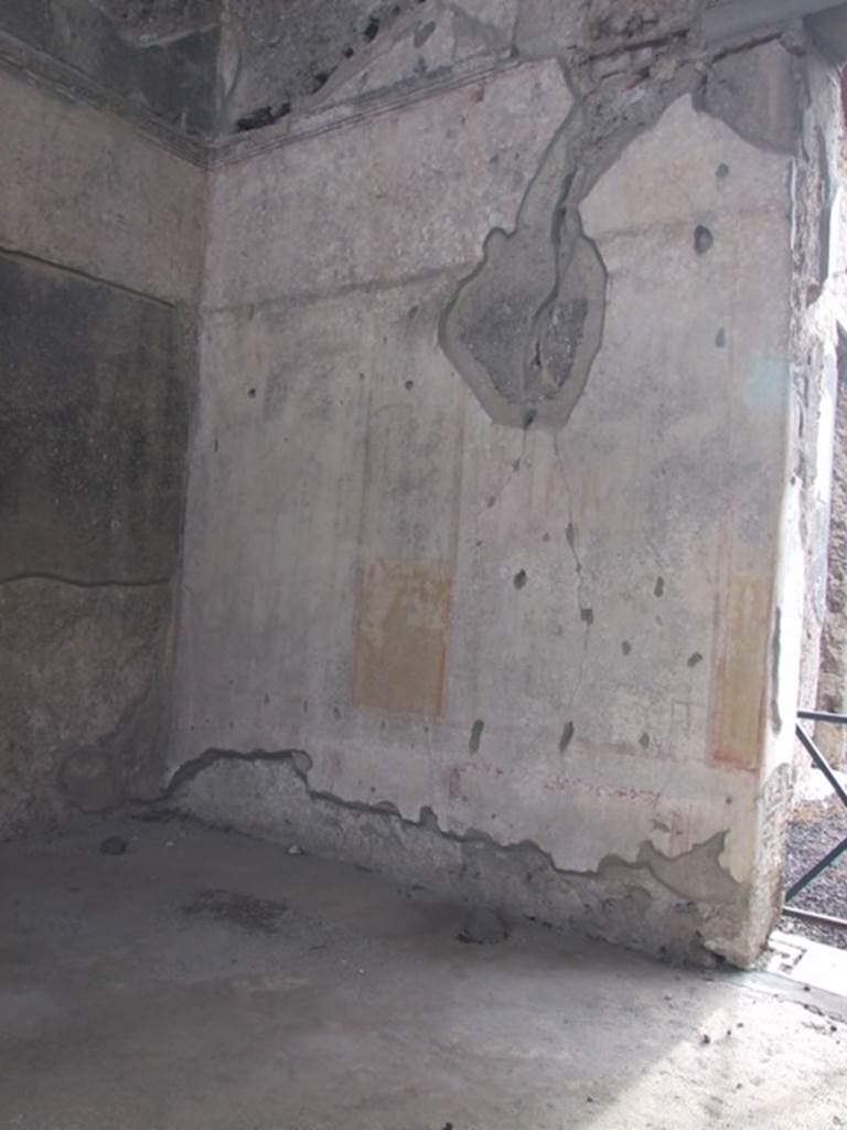IX.1.20 Pompeii. December 2007. Room 9, remains of wall painting on south wall, with doorway from atrium, on right. Mau states that on the two panels in the south-east corner are Muses. See Mau, A., 1907, translated by Kelsey F. W. Pompeii: Its Life and Art. New York: Macmillan. (p.312). According to Gallo, in the first panel on the right from the doorway would be Marsyas and Olympus on a white background. In the east panel of the south wall would be the Muse Euterpe. The panels were separated by a yellow band with architectural decoration. In the south panel on the east wall (on the left of this photo) would have been the MuseTerpsicore. See Gallo, A. (2000): I quadri perduti del triclinio “S” della casa di M. Epidio Rufo. (p.89) in Rivista di Studi Pompeiani, XI, 2000, “L’Erma” di Bretschneider, Rome, (p.87-100).