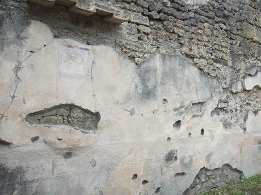 IX.1.22 Pompeii. December 2007. Room 19, west wall with remains of wall paintings at south end.
