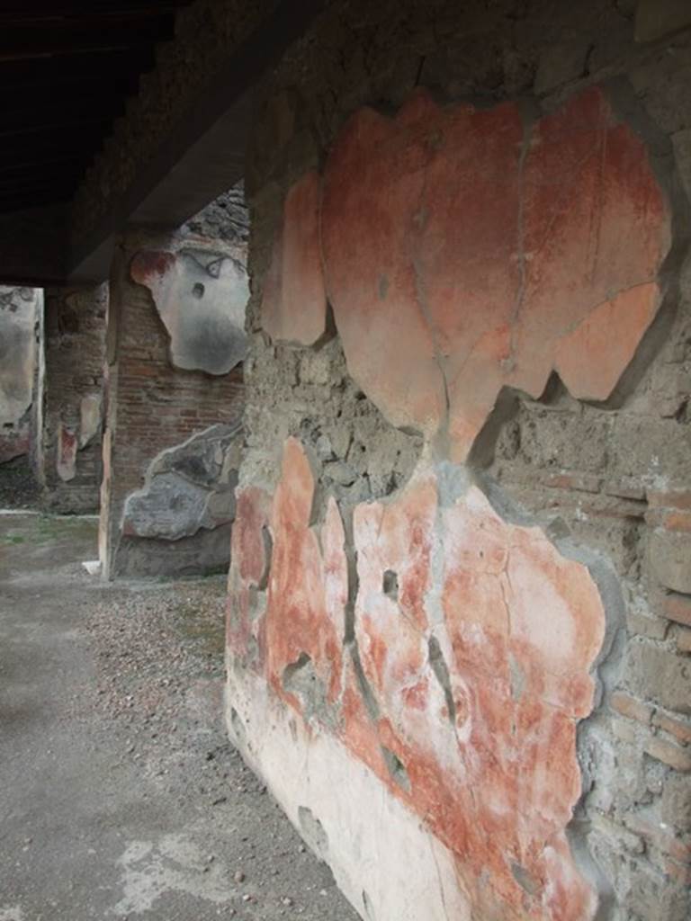 IX.1.22 House of M. Epidi Sabini.  December 2007.  Room 14.  First peristyle.  Painted plaster on north wall and doorways of rooms 20 and 21.