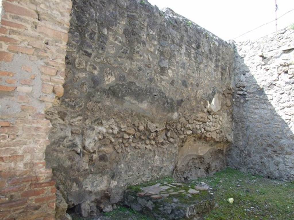 IX.1.27 Pompeii. March 2009. West wall, with base of stairs to upper floor and bed recess.