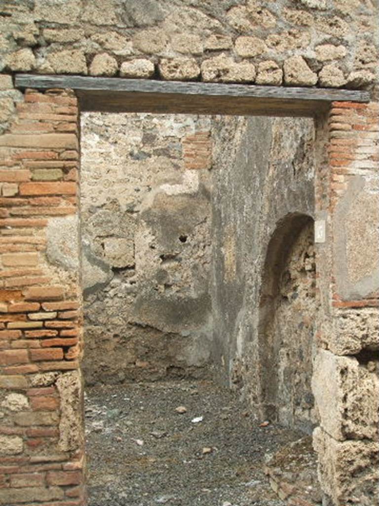 IX.2.13 Pompeii. May 2005. Looking north through entrance doorway, leading into two rooms with steps to upper floor.